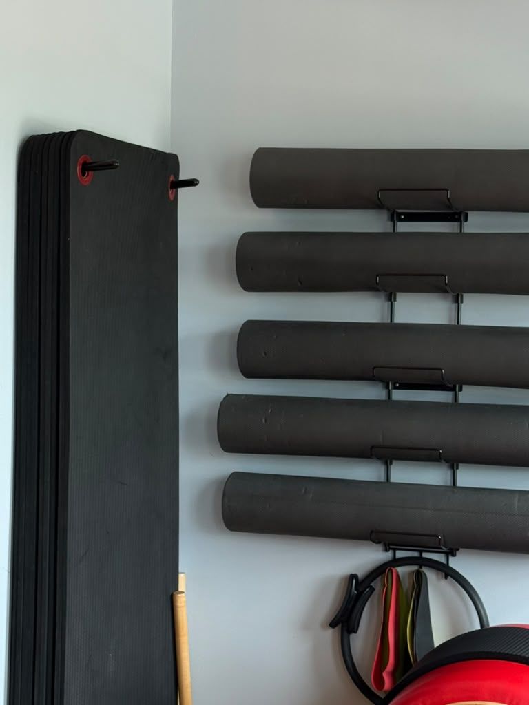 Mats and foam rollers ready for mat class