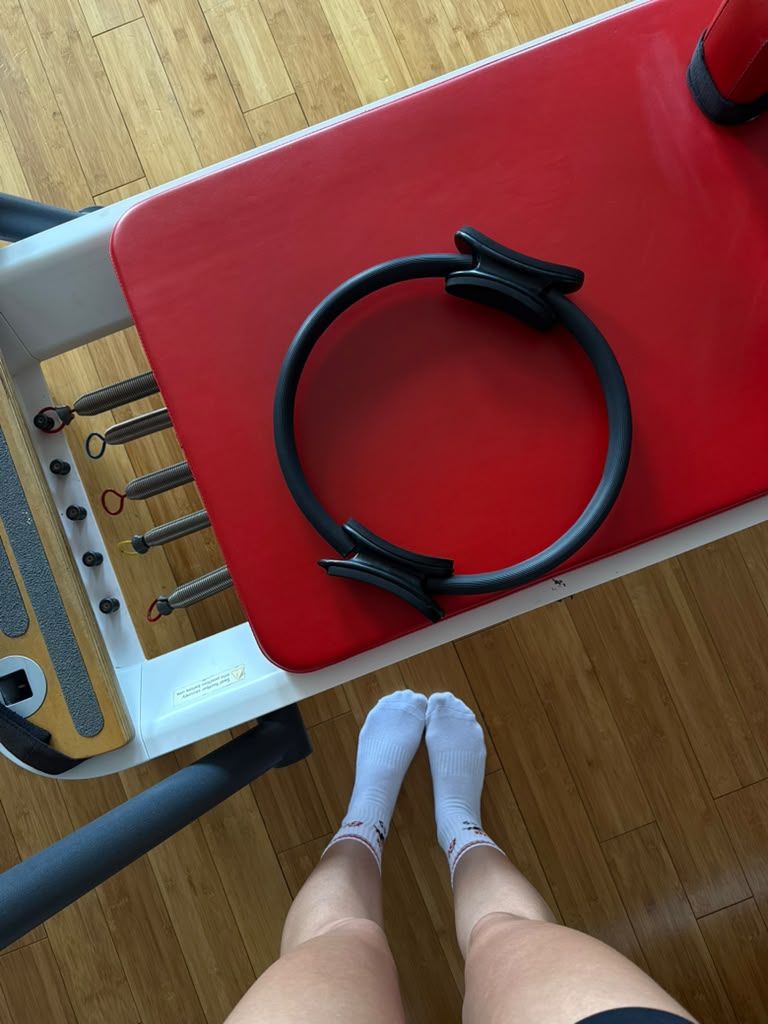 Pilates ring on a red reformer carriage